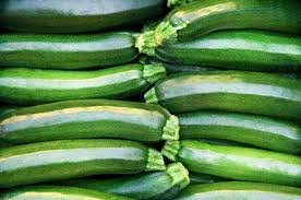 Fresh green zucchini on a wooden board