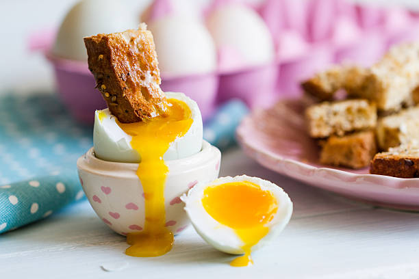 Fresh eggs in a carton on a kitchen counter